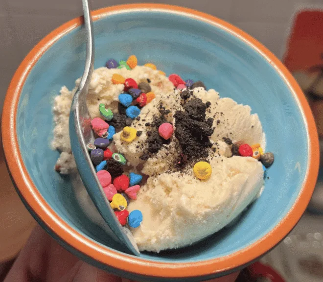 Close up of Bourbon Pecan Ice cream topped with chocolate bits.
